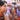 A young man holding hooks piercing his cheeks, while another man is getting pierced in the background, at Jor Soo Goong Naka Shrine, during Jay or Phuket Vegetarian Festival, also known as Thailand's self-mutilation festival; photo by Ivan Kralj.