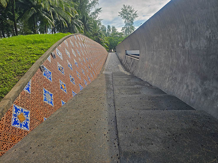 Curved wall with victim names plaques at Ban Nam Khem Tsunami Memorial Park in Khao Lak; photo by Ivan Kralj.