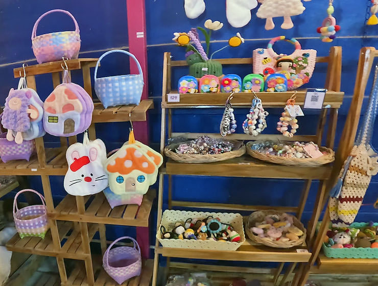 Colorful purses displayed on a stall at the Craft Market in Nimman, Chiang Mai, Thailand; photo by Ivan Kralj.