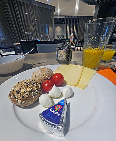 Breakfast plate with Zdenka triangle cheese in the focus, served at Magical Garden Restaurant in Hotel Jama, Postojna, Slovenia; photo by Ivan Kralj.