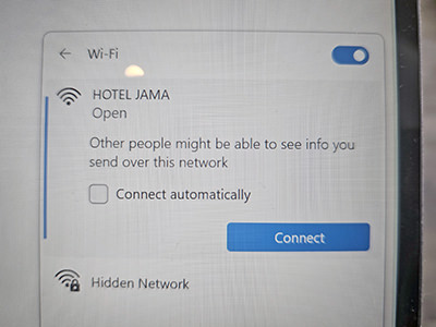 Standard Windows warning on open Wi-Fi networks, saying "Other people might be able to see info you send over this network"; particular WiFi network is the one that belongs to Hotel Jama in Postojna, Slovenia; photo by Ivan Kralj.