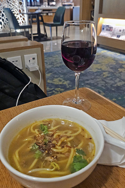 Mee Soto and wine, at Ambassador Transit Lounge at Singapore Changi Airport's Terminal 2; photo by Ivan Kralj.