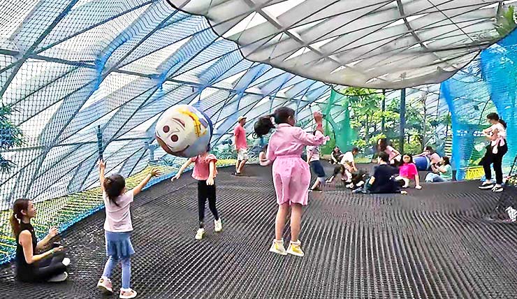 Children jumping on the Bouncing Net in Canopy Park, at Jewel Changi Airport in Singapore; photo by Ivan Kralj.