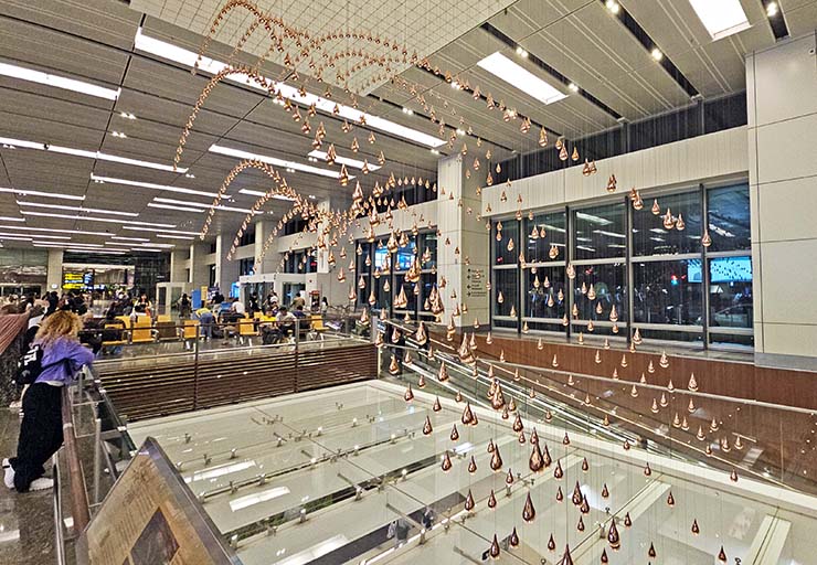 Kinetic Rain, a moving sculpture of bronze droplets forming various shapes at Singapore Changi Airport's Terminal 1; photo by Ivan Kralj.