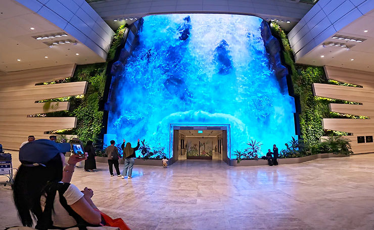 A digital waterfall made up of 892 LED tiles, known as the Wonderfall, at the check-in area of Singapore Changi Airport's Terminal 2; photo by Ivan Kralj.